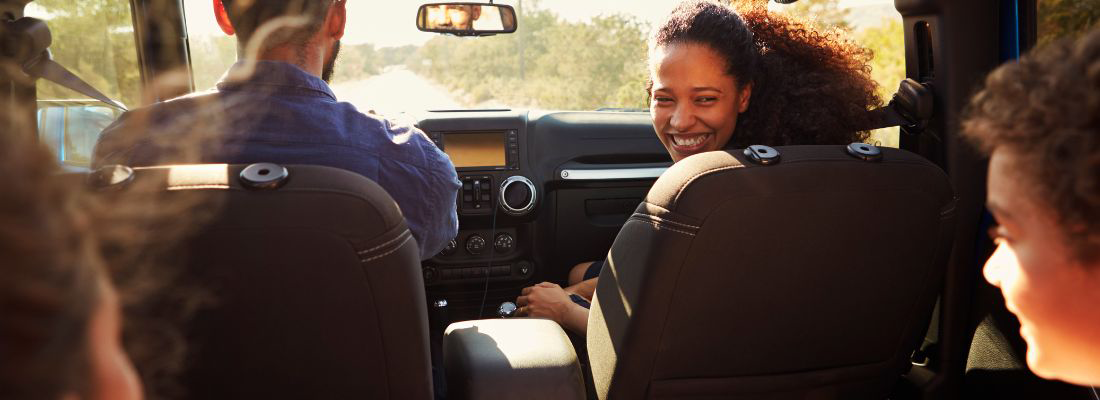 Young Couple with Kids in a Fox Rent A Car SUV 8-Seater